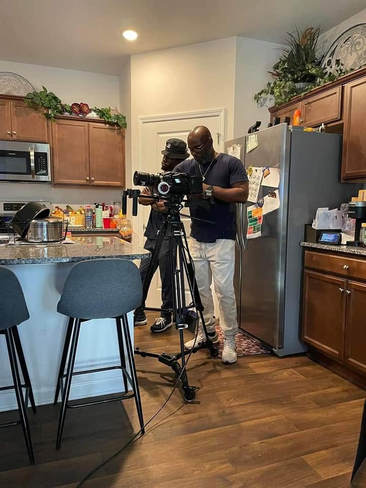 Demetris operating a cinema camera